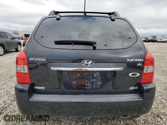 2009 Hyundai Tucson SE with VIN KM8JN72D49U975875, listed as a Copart auction lot 76923954 with 167,155 mi miles and Salvage Title. Bid and sale history available at carsss.com. Image 6.