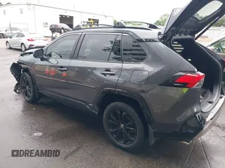 2022 Toyota RAV4 Hybrid SE with VIN JTM16RFV7ND067284, listed as a IAAI auction lot 42637821 with 20,512 mi miles and . Bid and sale history available at DreamBid. Image 3.
