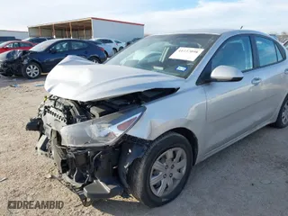 2023 Kia Rio S with VIN 3KPA24AD2PE573121, listed as a IAAI auction lot 41237098 with NaN miles. Bid and sale history available at carsss.com. Image 6.