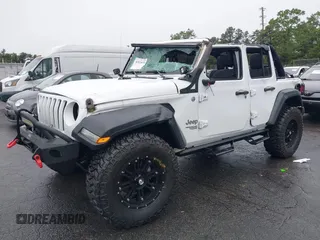 2018 Jeep Wrangler Unlimited Sport with VIN 1C4HJXDG0JW233696, listed as a IAAI auction lot 42523474 with 66,961 mi miles and . Bid and sale history available at DreamBid. Image 2.