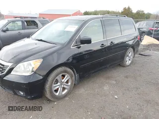 2010 Honda Odyssey Touring with VIN 5FNRL3H95AB040354, listed as a IAAI auction lot 41889501 with 155,069 mi miles. Bid and sale history available at carsss.com. Image 2.