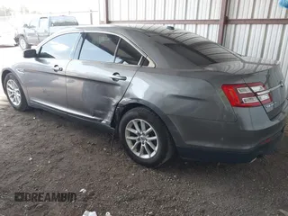 2014 Ford Taurus SE with VIN 1FAHP2D89EG136335, listed as a IAAI auction lot 41880655 with 211,635 mi miles. Bid and sale history available at carsss.com. Image 3.