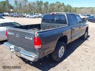 2002 Dodge Dakota SLT with VIN 1B7HG48NX2S623588, listed as a IAAI auction lot 41793068 with 213,159 mi miles. Bid and sale history available at carsss.com. Image 4.