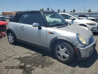 2006 MINI Convertible with VIN WMWRF33576TG16056, listed as a Copart auction lot 63127705 with 108,654 mi miles and Salvage title. Bid and sale history available at DreamBid. Image 4.