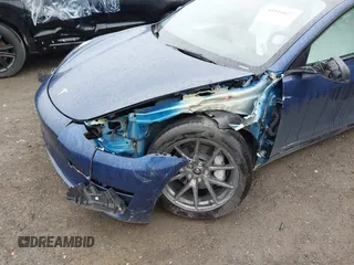 2023 Tesla Model 3 Long Range with VIN 5YJ3E1EB5PF704463, listed as a IAAI auction lot 41916627 with 14,305 mi miles and . Bid and sale history available at DreamBid. Image 6.