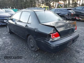 2003 Mitsubishi Lancer ES with VIN JA3AJ26E83U006060, listed as a IAAI auction lot 41254660 with 220,490 mi miles. Bid and sale history available at carsss.com. Image 3.