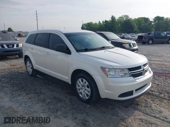 2015 Dodge Journey SE z VIN 3C4PDCAB9FT592689, wystawiony jako IAAI lot #42108322 z przebiegiem 158 140 mil mil oraz . Historia ofert i sprzedaży dostępna na DreamBid. Obrazek 1.