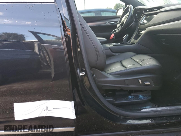 2022 Cadillac XT5 FWD Luxury z VIN 1GYKNAR47NZ100986, wystawiony jako Copart lot #83144574 z przebiegiem Nie podano mil oraz Nie do naprawy • Non repairable. Historia ofert i sprzedaży dostępna na DreamBid. Obrazek 13.