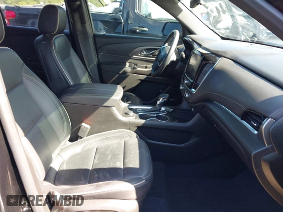 2023 Chevrolet Traverse Premier with VIN 1GNERKKW5PJ128805, listed as a IAAI auction lot 42032622 with 36,463 mi miles and . Bid and sale history available at DreamBid. Image 5.