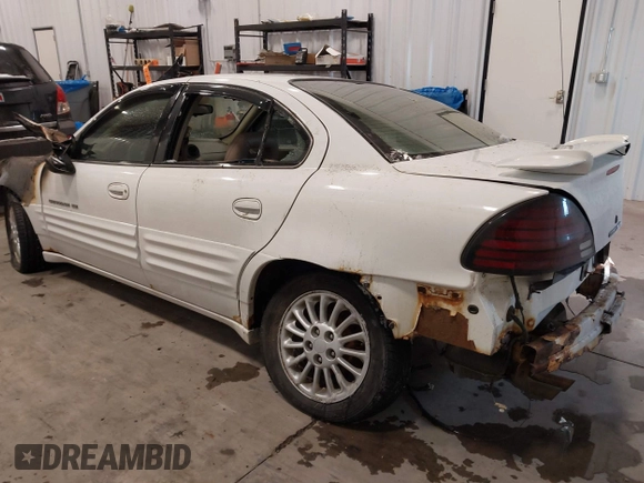 1999 Pontiac Grand Am SE2 with VIN 1G2NE52E4XM864232, listed as a IAAI auction lot 41321705 with 1 mi miles. Bid and sale history available at carsss.com. Image 3.