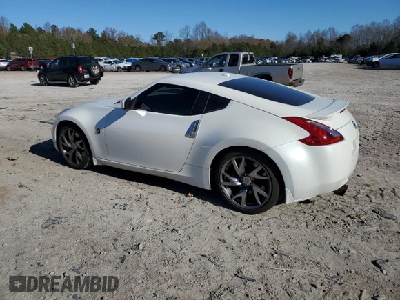 2014 Nissan 370Z Touring with VIN JN1AZ4EH1EM635411, listed as a Copart auction lot 82670344 with 77,501 mi miles and Salvage Title. Bid and sale history available at carsss.com. Image 2.