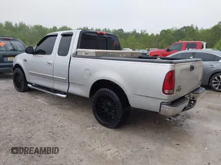 2003 Ford F-150 XL with VIN 1FTRX17253NA74389, listed as a IAAI auction lot 42072045 with 166,572 mi miles. Bid and sale history available at carsss.com. Image 3.
