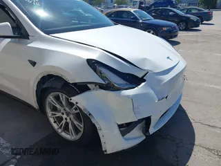2023 Tesla Model Y Long Range with VIN 7SAYGDEE2PF696336, listed as a IAAI auction lot 41894686 with 34,203 mi miles. Bid and sale history available at carsss.com. Image 6.