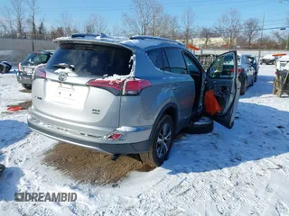 2018 Toyota RAV4 XLE with VIN 2T3RFREV8JW753853, listed as a IAAI auction lot 41526071 with 104,642 mi miles. Bid and sale history available at carsss.com. Image 4.