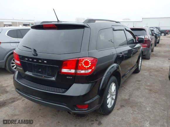 2013 Dodge Journey SXT with VIN 3C4PDCBB1DT565028, listed as a IAAI auction lot 41483127 with 129,997 mi miles. Bid and sale history available at carsss.com. Image 4.