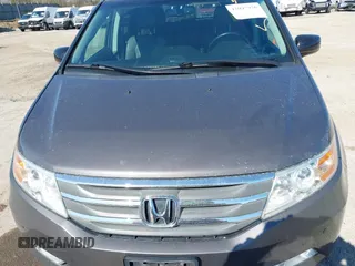 2012 Honda Odyssey Touring with VIN 5FNRL5H9XCB077351, listed as a IAAI auction lot 42045976 with 146,290 mi miles and . Bid and sale history available at DreamBid. Image 6.