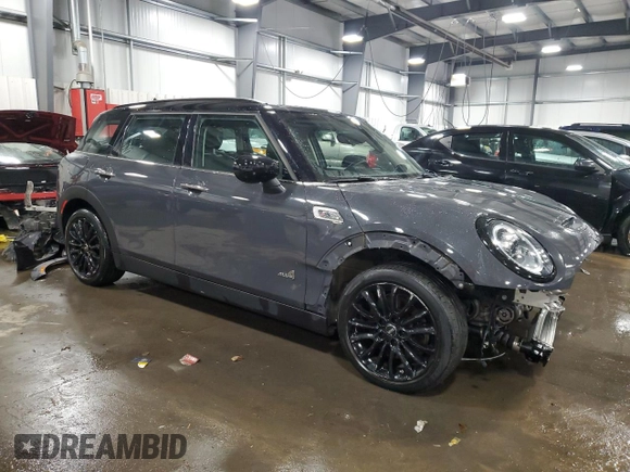 2021 MINI Clubman Cooper S with VIN WMWXJ1C05M2P49901, listed as a Copart auction lot 83023554 with 49,357 mi miles and Salvage Title. Bid and sale history available at carsss.com. Image 4.