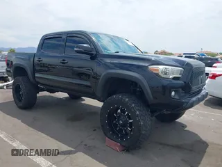 2018 Toyota Tacoma SR with VIN 5TFCZ5ANXJX144089, listed as a IAAI auction lot 42761947 with 129,568 mi miles and . Bid and sale history available at DreamBid. Image 1.