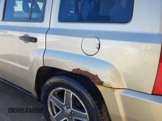 2009 Jeep Patriot Sport with VIN 1J4FT28B59D195435, listed as a IAAI auction lot 40758450 with 130,728 mi miles. Bid and sale history available at carsss.com. Image 13.