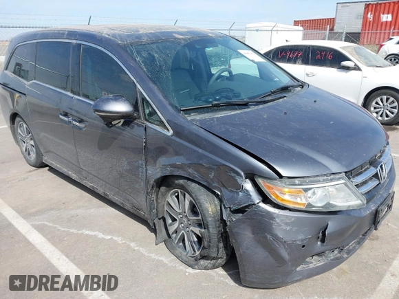 2014 Honda Odyssey Touring with VIN 5FNRL5H91EB093540, listed as a IAAI auction lot 41887412 with 202,076 mi miles and . Bid and sale history available at DreamBid. Image 6.