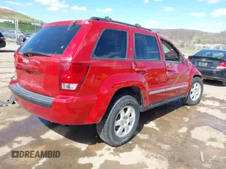 2010 Jeep Grand Cherokee Laredo with VIN 1J4PR4GK9AC143199, listed as a IAAI auction lot 41972153 with 81,896 mi miles. Bid and sale history available at carsss.com. Image 4.