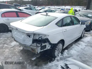 2014 Ford Fusion SE Hybrid with VIN 3FA6P0LU7ER395795, listed as a IAAI auction lot 41515505 with 58,037 mi miles. Bid and sale history available at carsss.com. Image 4.