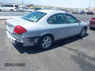 2003 Ford Taurus SE Standard with VIN 1FAFP53UX3G268265, listed as a IAAI auction lot 42090151 with 139,734 mi miles. Bid and sale history available at carsss.com. Image 4.