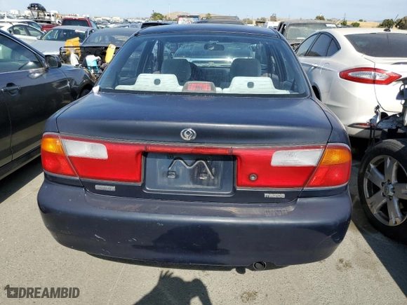1997 Mazda Protege DX with VIN JM1BC1412V0157268, listed as a Copart auction lot 61380564 with 85,356 mi miles and Salvage Title. Bid and sale history available at carsss.com. Image 6.