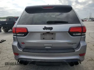 2018 Jeep Grand Cherokee Trackhawk with VIN 1C4RJFN91JC223825, listed as a Copart auction lot 58011465 with 83,177 mi miles and Salvage title. Bid and sale history available at DreamBid. Image 6.