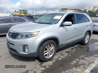 2014 Kia Sorento LX with VIN 5XYKTCA69EG496907, listed as a IAAI auction lot 41789120 with 166,644 mi miles and . Bid and sale history available at carsss.com. Image 2.