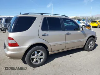 2004 Mercedes-Benz M-Class 5.0L with VIN 4JGAB75E64A488281, listed as a Copart auction lot 77031744 with 128,699 mi miles and Salvage Title. Bid and sale history available at carsss.com. Image 3.