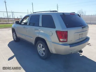 2010 Jeep Grand Cherokee Laredo with VIN 1J4PS4GK1AC111965, listed as a IAAI auction lot 41776362 with 209,042 mi miles. Bid and sale history available at carsss.com. Image 3.