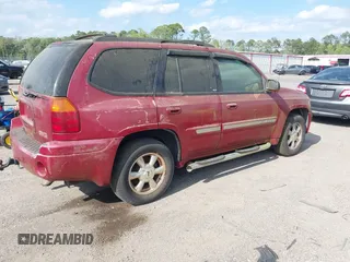 2004 GMC Envoy SLT with VIN 1GKDS13SX42334503, listed as a IAAI auction lot 42038781 with 242,680 mi miles. Bid and sale history available at carsss.com. Image 4.