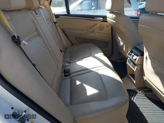 2007 BMW X5 3.0si with VIN 5UXFE43567LY82907, listed as a IAAI auction lot 41499356 with 117,173 mi miles. Bid and sale history available at carsss.com. Image 8.
