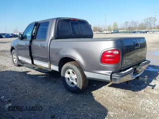 2003 Ford F-150 XLT with VIN 1FTRW07L13KB66977, listed as a IAAI auction lot 41967541 with 124,714 mi miles. Bid and sale history available at carsss.com. Image 3.