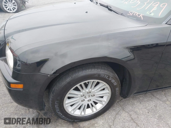 2009 Chrysler 300 LX with VIN 2C3KA43D19H506753, listed as a IAAI auction lot 42053199 with 106,092 mi miles. Bid and sale history available at carsss.com. Image 12.