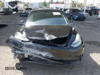 2019 Tesla Model 3 Mid Range with VIN 5YJ3E1EA1KF410297, listed as a IAAI auction lot 41841991 with 176,254 mi miles. Bid and sale history available at carsss.com. Image 12.