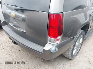 2014 Chevrolet Tahoe LT with VIN 1GNSCBE08ER106419, listed as a IAAI auction lot 41789896 with 99,420 mi miles and . Bid and sale history available at DreamBid. Image 6.