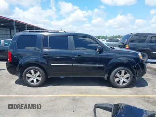 2013 Honda Pilot Touring z VIN 5FNYF3H98DB023104, wystawiony jako IAAI lot #42310538 z przebiegiem 169 385 mil mil oraz . Historia ofert i sprzedaży dostępna na DreamBid. Obrazek 13.