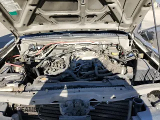 2004 Nissan Frontier XE z VIN 1N6ED27T94C461253, wystawiony jako Copart lot #86311014 z przebiegiem 174 836 mil mil oraz Szkoda całkowita • Salvage title. Historia ofert i sprzedaży dostępna na DreamBid. Obrazek 11.