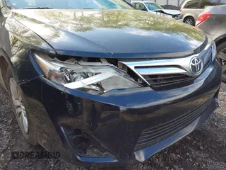 2014 Toyota Camry L with VIN 4T4BF1FK7ER395057, listed as a IAAI auction lot 42215441 with 166,247 mi miles and . Bid and sale history available at DreamBid. Image 22.