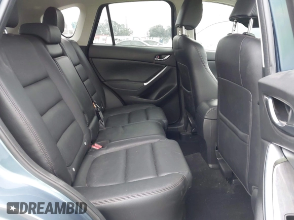 2016 Mazda CX-5 Grand Touring with VIN JM3KE2DY7G0875678, listed as a IAAI auction lot 42104888 with 30,566 mi miles. Bid and sale history available at carsss.com. Image 8.