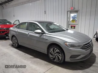 2020 Volkswagen Jetta SEL z VIN 3VWE57BU0LM087350, wystawiony jako IAAI lot #41581637 z przebiegiem 60 528 mil mil oraz . Historia ofert i sprzedaży dostępna na DreamBid. Obrazek 13.