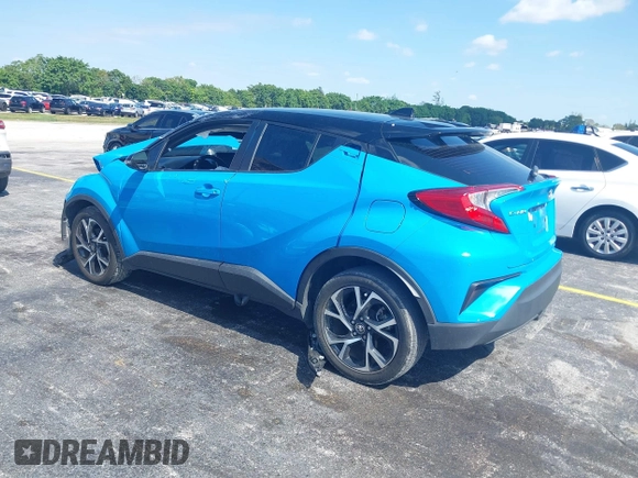 2019 Toyota C-HR XLE with VIN NMTKHMBX6KR097934, listed as a IAAI auction lot 39276687 with 56,973 mi miles. Bid and sale history available at carsss.com. Image 3.