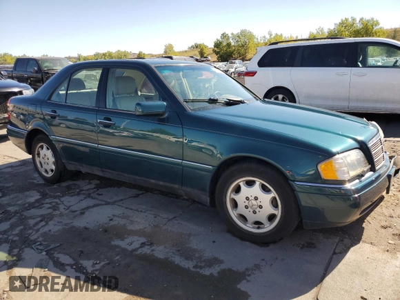 1997 Mercedes-Benz C with VIN WDBHA23EXVF507185, listed as a Copart auction lot 73716364 with 167,171 mi miles and Salvage title. Bid and sale history available at DreamBid. Image 4.