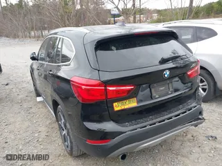 2018 BMW X1 xDrive28i with VIN WBXHT3C34J5K21576, listed as a IAAI auction lot 41822390 with 69,645 mi miles. Bid and sale history available at carsss.com. Image 3.