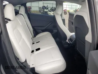 2024 Tesla Model Y Performance with VIN 7SAYGDEF7RF093054, listed as a Copart auction lot 50747985 with 26,907 mi miles and Salvage Title. Bid and sale history available at DreamBid. Image 11.