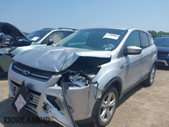 2014 Ford Escape SE with VIN 1FMCU9GX3EUC42964, listed as a IAAI auction lot 42484080 with 124,696 mi miles and . Bid and sale history available at DreamBid. Image 2.
