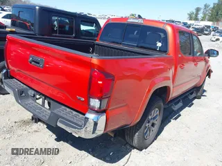 2018 Toyota Tacoma SR5 with VIN 5TFAZ5CN5JX066115, listed as a IAAI auction lot 41816133 with 70,283 mi miles and . Bid and sale history available at DreamBid. Image 4.