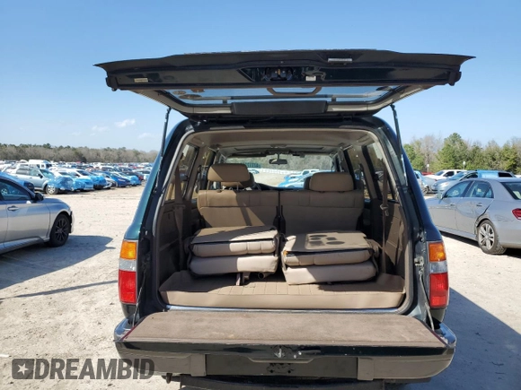 1995 Toyota Land Cruiser z VIN JT3DJ81W6S0106332, wystawiony jako Copart lot #47772055 z przebiegiem 214 499 mil mil oraz Szkoda całkowita • Salvage title. Historia ofert i sprzedaży dostępna na DreamBid. Obrazek 6.